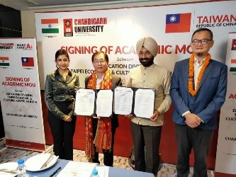 Baushuan Ger and Prof. Himani Sood holding the MOU immediately after the signing